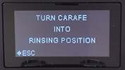 Turn carafe into rinsing position